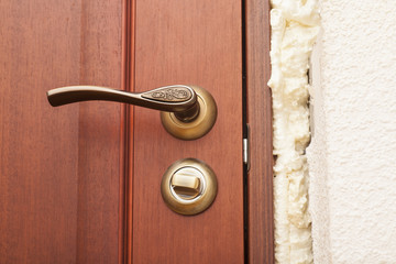 handle and wooden door close up