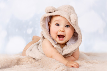 Adorable little baby crawling on the floor and wearing hoodie © allari