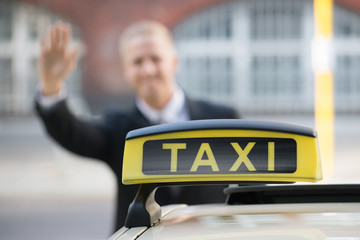Businessman Catching Taxi