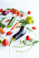 Raw eggplant with vegetables on table, selective focus