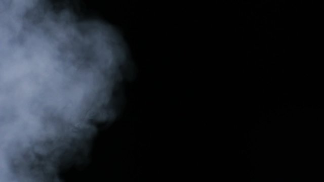 Smoke coming out on black background shooting with high speed camera, phantom flex.