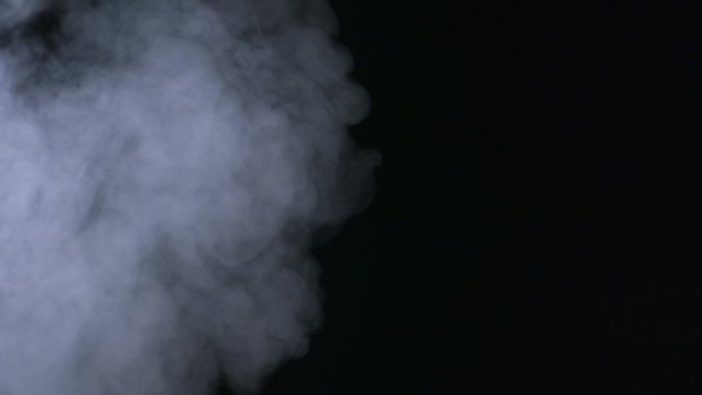 Smoke coming out on black background shooting with high speed camera, phantom flex.