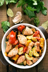 Roasted vegetables with chicken meat in pan