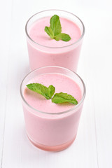 Berries milkshake decorated with mint