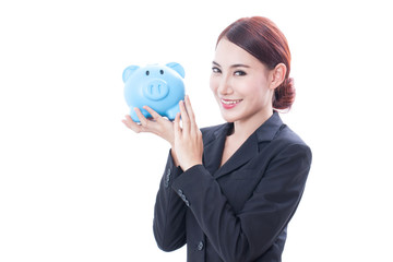 Portrait of businesswoman holding piggy bank on white background