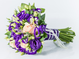 Close-up of bridal bouquet in purple tones isolated on white bac