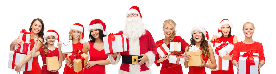 santa calaus and happy women with gift boxes