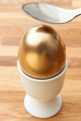 Spoon Cracking Golden Egg