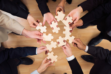 Business Team Joining Jigsaw Pieces
