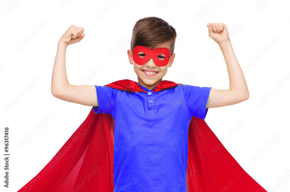 Wall mural boy in red super hero cape and mask showing fists