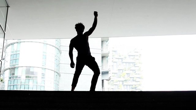 Male dancer performing in the city