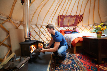 Couple Enjoying Luxury Camping Holiday In Yurt - Powered by Adobe