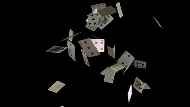 Playing cards falling on black background shooting with high speed camera, phantom flex.