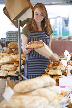 Owner Of Bread Stall At Outdoor Market
