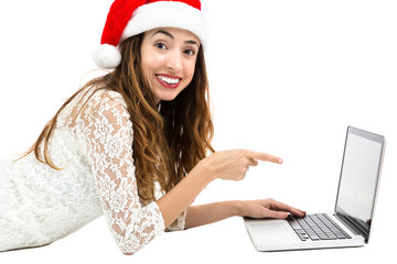 Christmas woman pointing to laptop