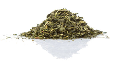 Dried Japanese green tea over white background