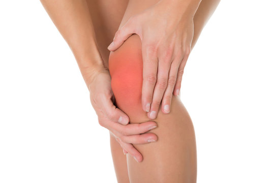 Cropped Image Of Woman Suffering From Knee Pain