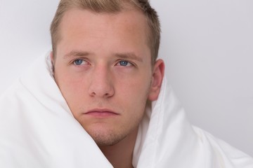 Obraz premium Wrapped up in bedclothes