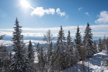 Beautiful sun shining over a valley covered in snow