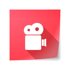 Long shadow vector sticky note icon with a film camera