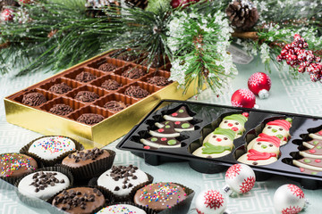 Assorted chocolate, candies, chocolate cookies.