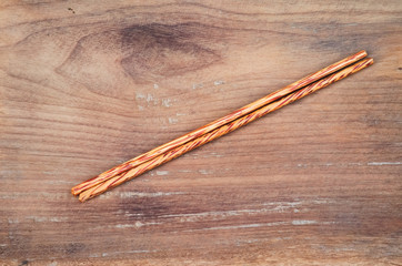chopsticks on rustic wooden background