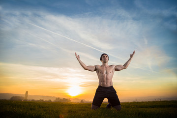 fitness man with hands toward sky