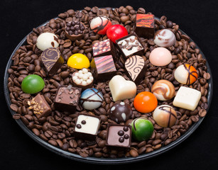 Set of a various chocolate pralines and coffee beans