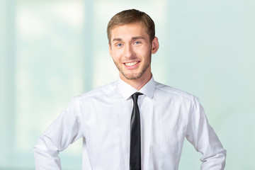 Young handsome businessman smiling