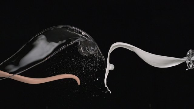 White, beige paint and water splash in the air shooting with high speed camera, phantom flex.