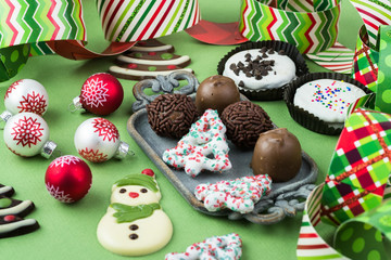Chocolate candies and cookies with Christmas decoration.