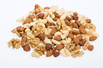  mixed nuts  -  hazelnuts, walnuts, cashews,  pine nuts isolated on white background