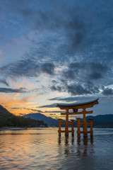 Sunset at the famous floating torii gate of the Itsukushima Shri