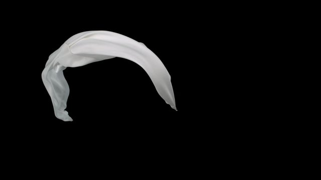 White fabric flowing in the air on black background shooting with high speed camera, phantom flex.