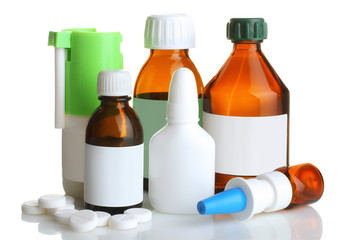 pills and bottle with the cure for the common cold isolated on white background