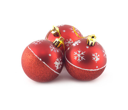 Three red Christmas balls isolated on white background. Studio shot closeup