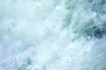 Bottom of Upper Falls, in Yellowstone National Park, is one huge spray of water.  White foam and...