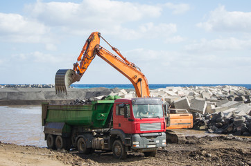 Excavator loading a truck