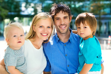 Fototapeta premium Young family with two kids 