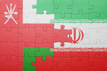 puzzle with the national flag of iran and oman