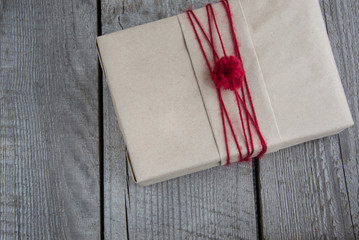 Christmas gift box handicraft wrapping, parchment, twine. Top view.
