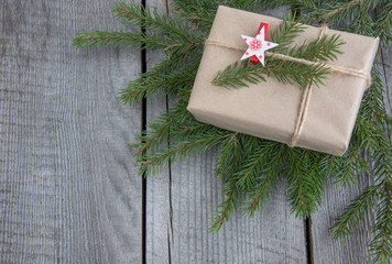 Christmas gift box handicraft wrapping, parchment, twine fir tree twigs, cute simple last minute present handmade. Top view.