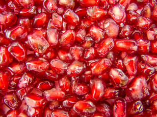 texture background made of colorful pomegranate seeds 