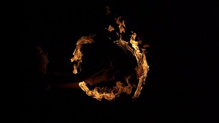 Fire performer playing with fire shooting with high speed camera, phantom flex.