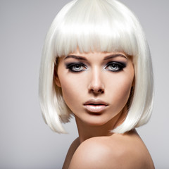  Fashion portrait of young woman with blond hairs and black make