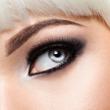  woman's eye with black eye makeup. Macro style image