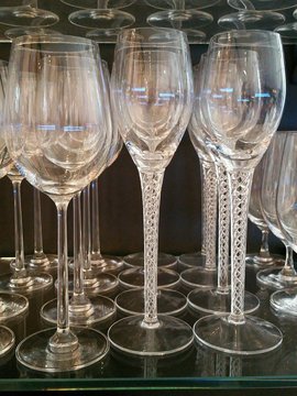 Wine and Champagne Stemmed Glasses Line Up on Shelf