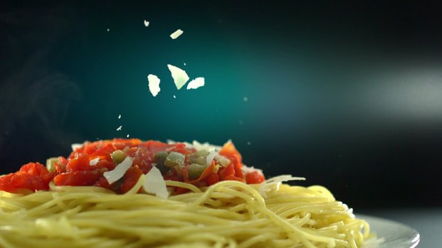 Putting parmesan chese on spaghetti shooting with high speed camera, phantom flex.