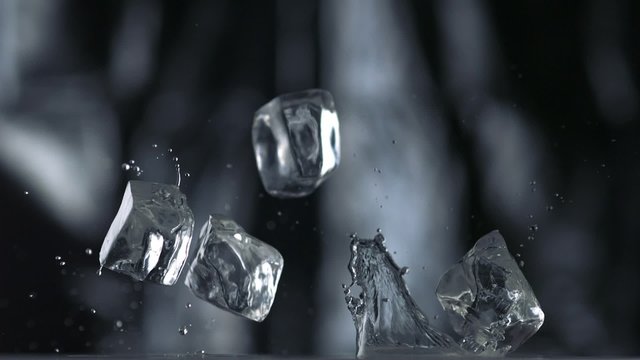 Cubes falling and bouncing on puddle shooting with high speed camera, phantom flex.