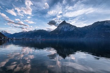 .Magnificent sky over mountain range and lake.